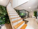 Modern staircase with indoor garden and living space