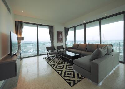 Modern living room with large windows and balcony view