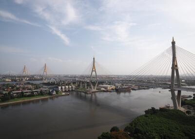 Aerial view of a large suspension bridge over a wide river