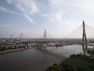 Aerial view of a large suspension bridge over a wide river