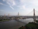 Aerial view of a large suspension bridge over a wide river