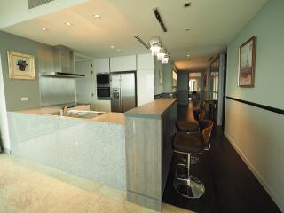 Modern kitchen with breakfast bar and stainless steel appliances