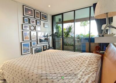 Modern bedroom with gallery wall and private balcony