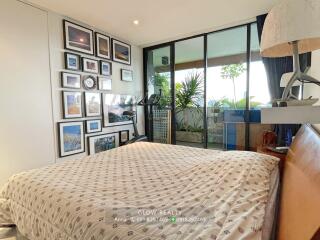 Modern bedroom with gallery wall and private balcony