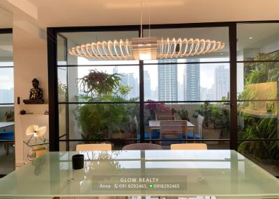 Modern dining room with glass table and city view