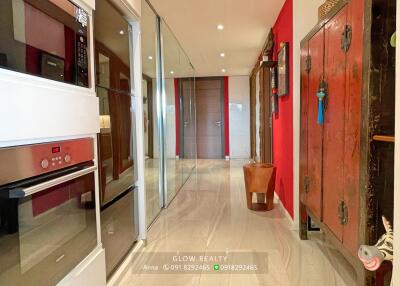 Modern kitchen with built-in appliances and glass doors