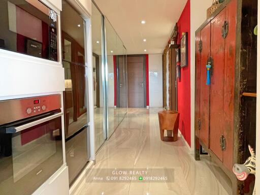 Modern kitchen with built-in appliances and glass doors