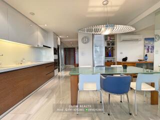 Modern kitchen and dining area with sleek furnishings