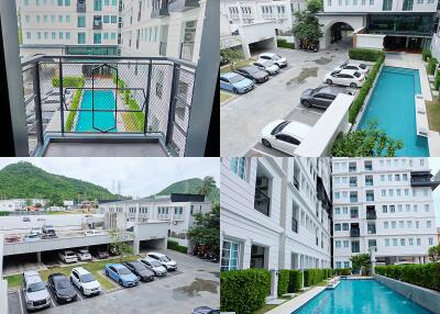 Exterior view of a residential complex with swimming pool and parking area