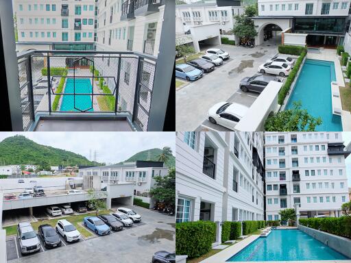 Exterior view of a residential complex with swimming pool and parking area