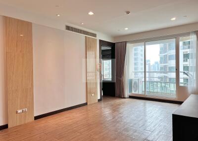 Modern living room with large windows and city view