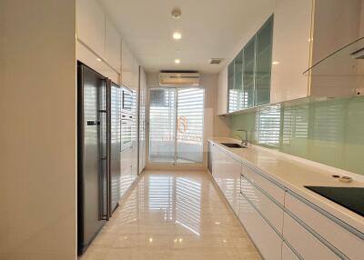 Modern kitchen with built-in appliances and ample storage