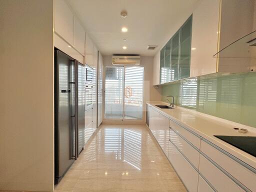 Modern kitchen with built-in appliances and ample storage