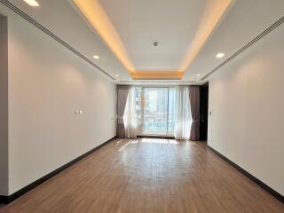 Bright spacious living room with wooden flooring and large windows