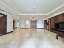 Spacious modern living room with glossy tile flooring and recessed lighting