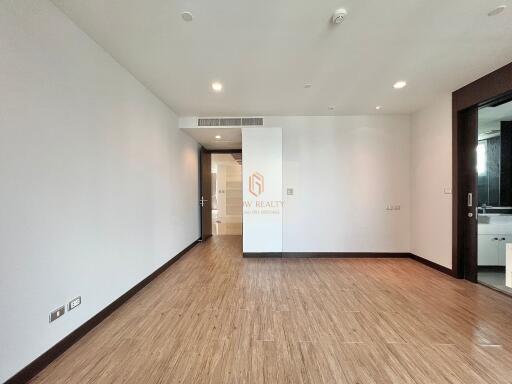 Spacious living room with wooden flooring