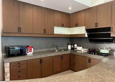 Modern kitchen with wooden cabinets and granite countertops