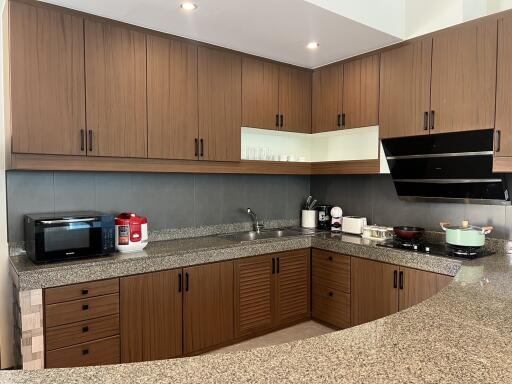 Modern kitchen with wooden cabinets and granite countertops