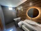 Modern bathroom with wooden accent wall and contemporary fixtures