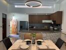 Modern kitchen and dining area with contemporary lighting