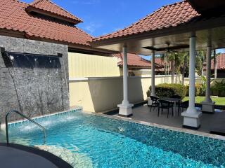 Outdoor area with swimming pool and covered patio