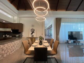 Modern dining area with stylish chandelier