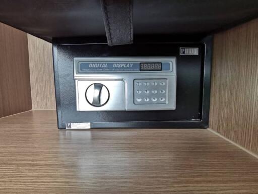 Digital safe in wooden cabinet