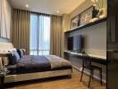 Modern bedroom with bed, bedside table, wall art, and TV