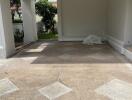 Covered garage space with a view of the garden