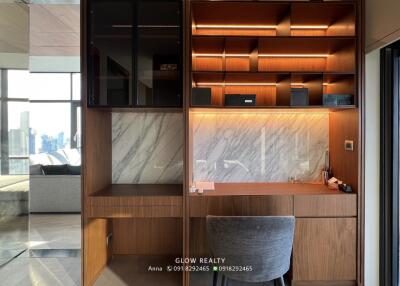 Modern home office with wooden shelves and marble accents