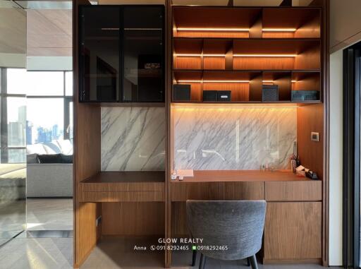 Modern home office with wooden shelves and marble accents