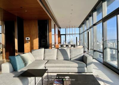 Modern living room with city view and large windows