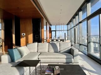Modern living room with city view and large windows