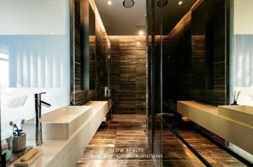 Modern bathroom with double sinks and large mirror