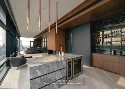 Modern kitchen with marble island and built-in appliances