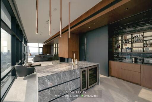 Modern kitchen with marble island and built-in appliances