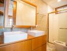 Modern bathroom with wooden cabinets and double sink