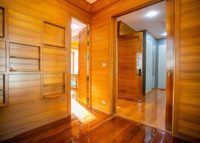 Bright wooden hallway with doors leading to other rooms