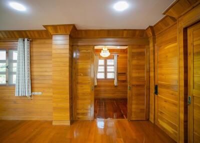 Spacious wooden bedroom with natural lighting