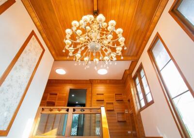 Stylish wooden interior with chandelier