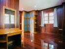 Spacious bedroom with wooden interior and large windows