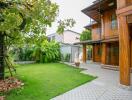 Exterior view of a wooden house with garden