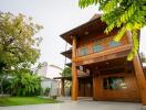 Exterior view of a wooden house with garden