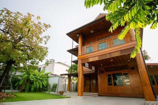 Exterior view of a wooden house with garden