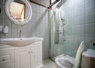 Modern bathroom with white vanity and glass shower