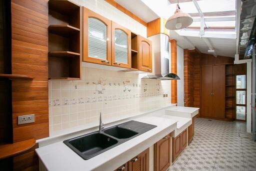 Spacious kitchen with wooden cabinets and modern fixtures