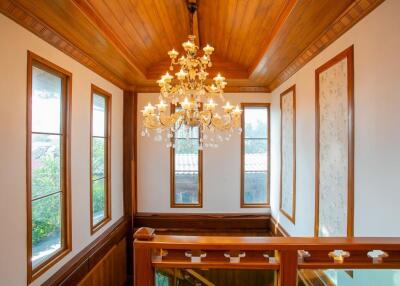 Interior view of a stairway with a chandelier