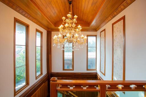 Interior view of a stairway with a chandelier