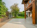 Outdoor patio with garden and wooden columns