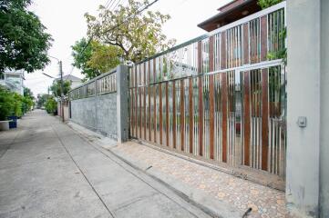 Exterior view of a gated property entrance